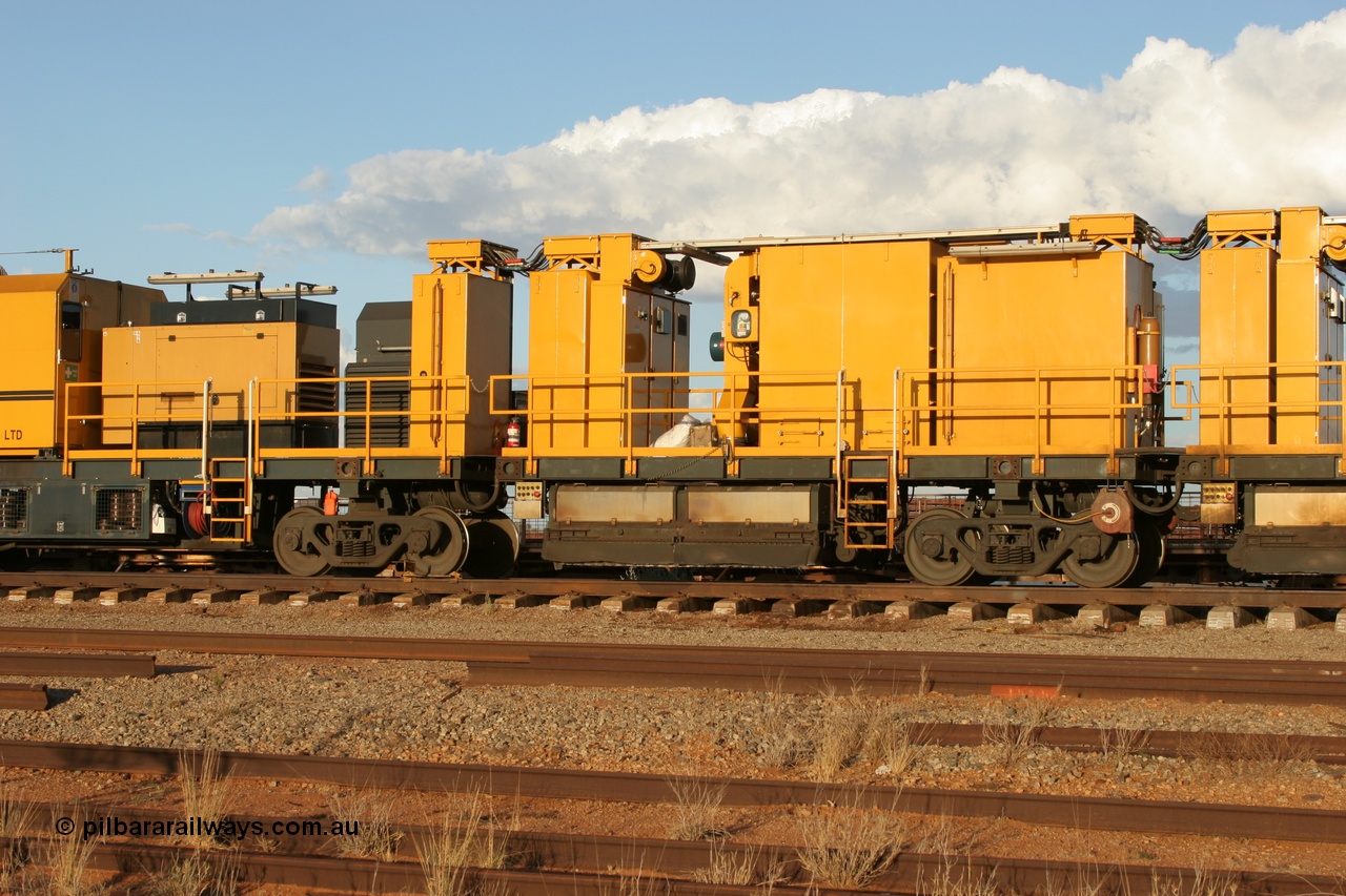 050414 0952
Flash Butt yard, Speno Australia's RR24 model 24 stone rail grinder serial M20 before it had id stickers fitted, this unit was later stickered as RG 1, rear view of the air compressor and driving module coupled to the third grinding module. 14th April 2005.
Keywords: Speno;RR24;M20;track-machine;