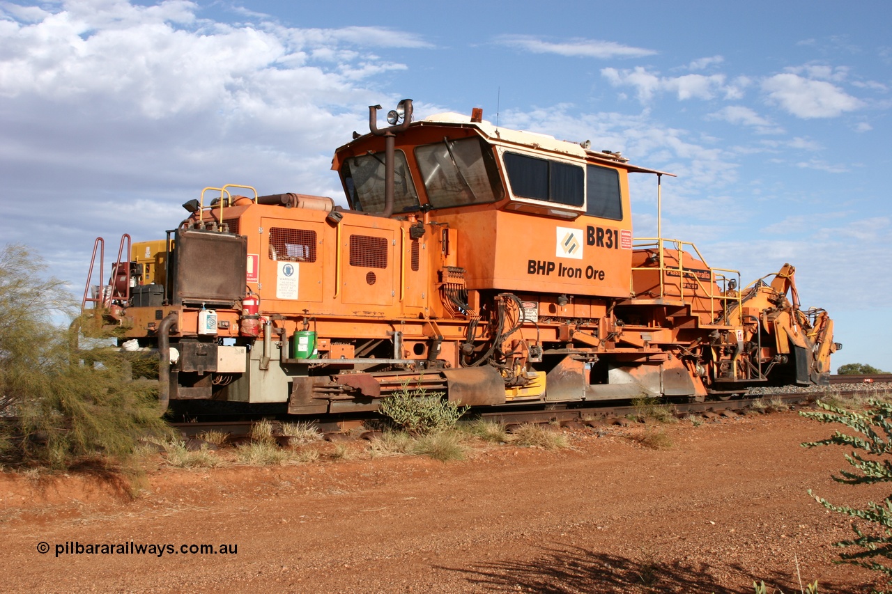 050421 1142
Gillam Siding backtrack, BHP's ballast regulator BR 31 a Plasser Australia SSP 110SW model serial 401, 94.9 km marking on the rail. 21st April 2005.
Keywords: BR31;Plasser-Australia;SSP-110SW;401;track-machine;