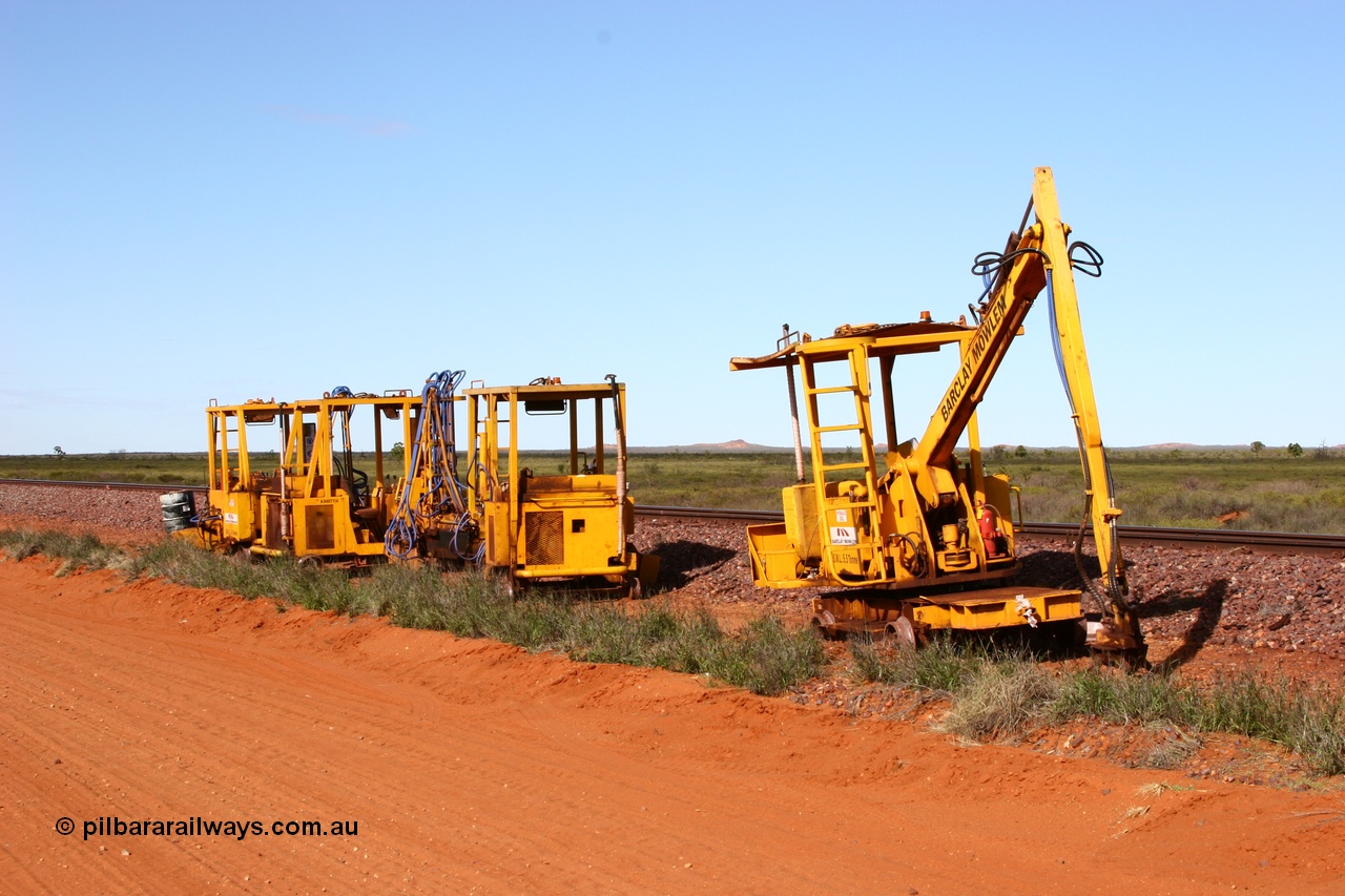 050625 3811
Node 2 at the 38 km on the GML or former Goldsworthy mainline, some Barclay Mowlem track machines are off clear of the running lines, a sleeper crane is at the front with three sleeper inserters behind. 25th June 2005.
Keywords: track-machine;