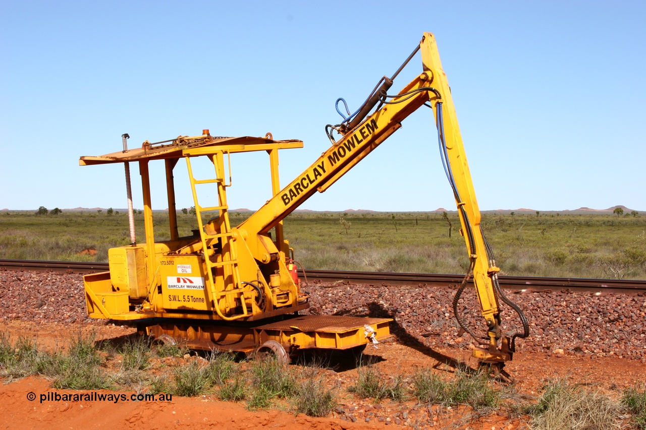 050625 3812
Node 2 at the 38 km on the GML or former Goldsworthy mainline, a Barclay Mowlem track machine sleeper crane off clear of the running lines. 25th June 2005.
Keywords: track-machine;