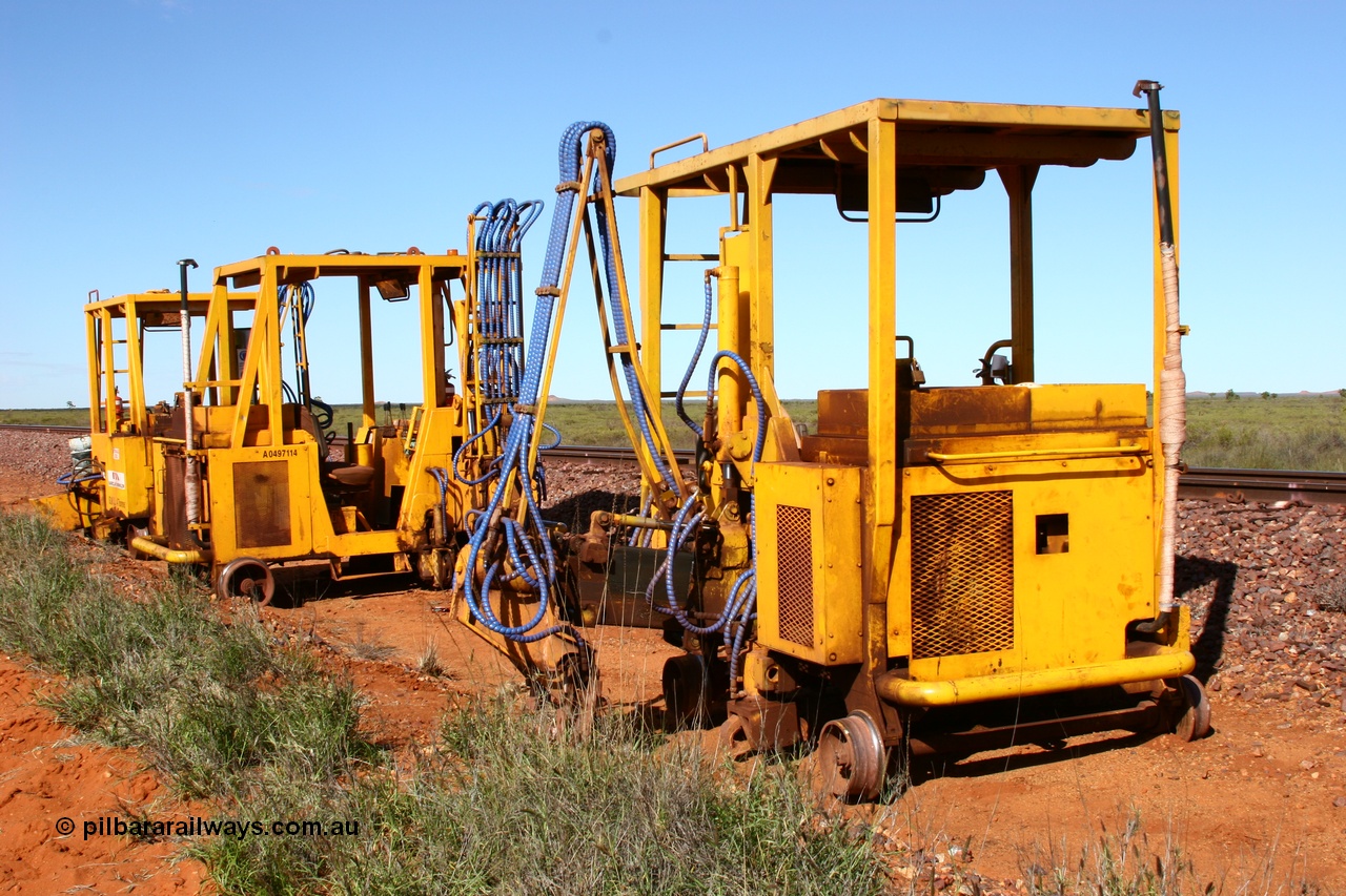 050625 3818
Node 2 at the 38 km on the GML or former Goldsworthy mainline, three Barclay Mowlem sleeper inserter track machines off clear of the running lines. 25th June 2005.
Keywords: track-machine;