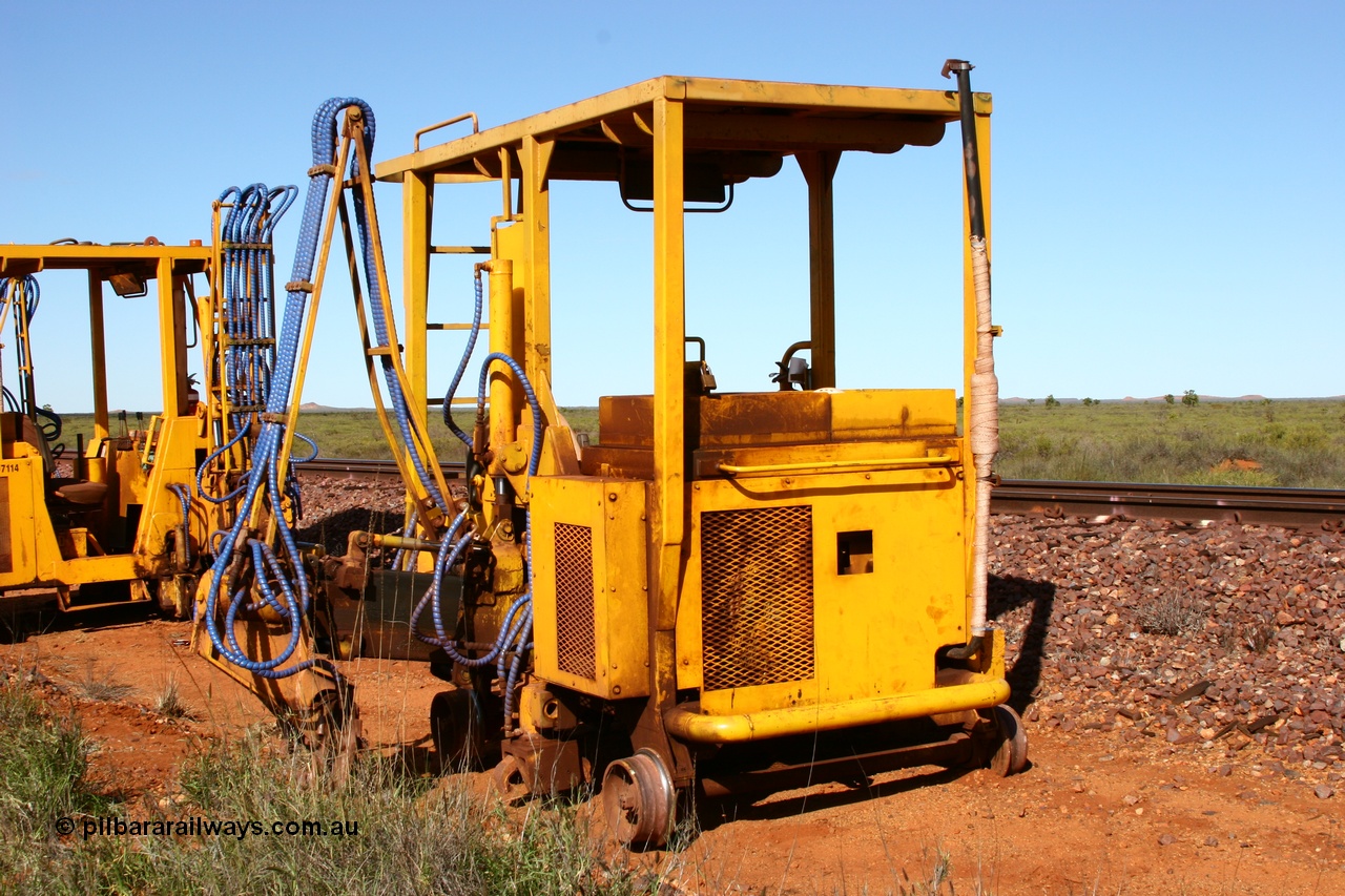 050625 3819
Node 2 at the 38 km on the GML or former Goldsworthy mainline, a Barclay Mowlem sleeper inserter track machine off clear of the running lines. 25th June 2005.
Keywords: track-machine;