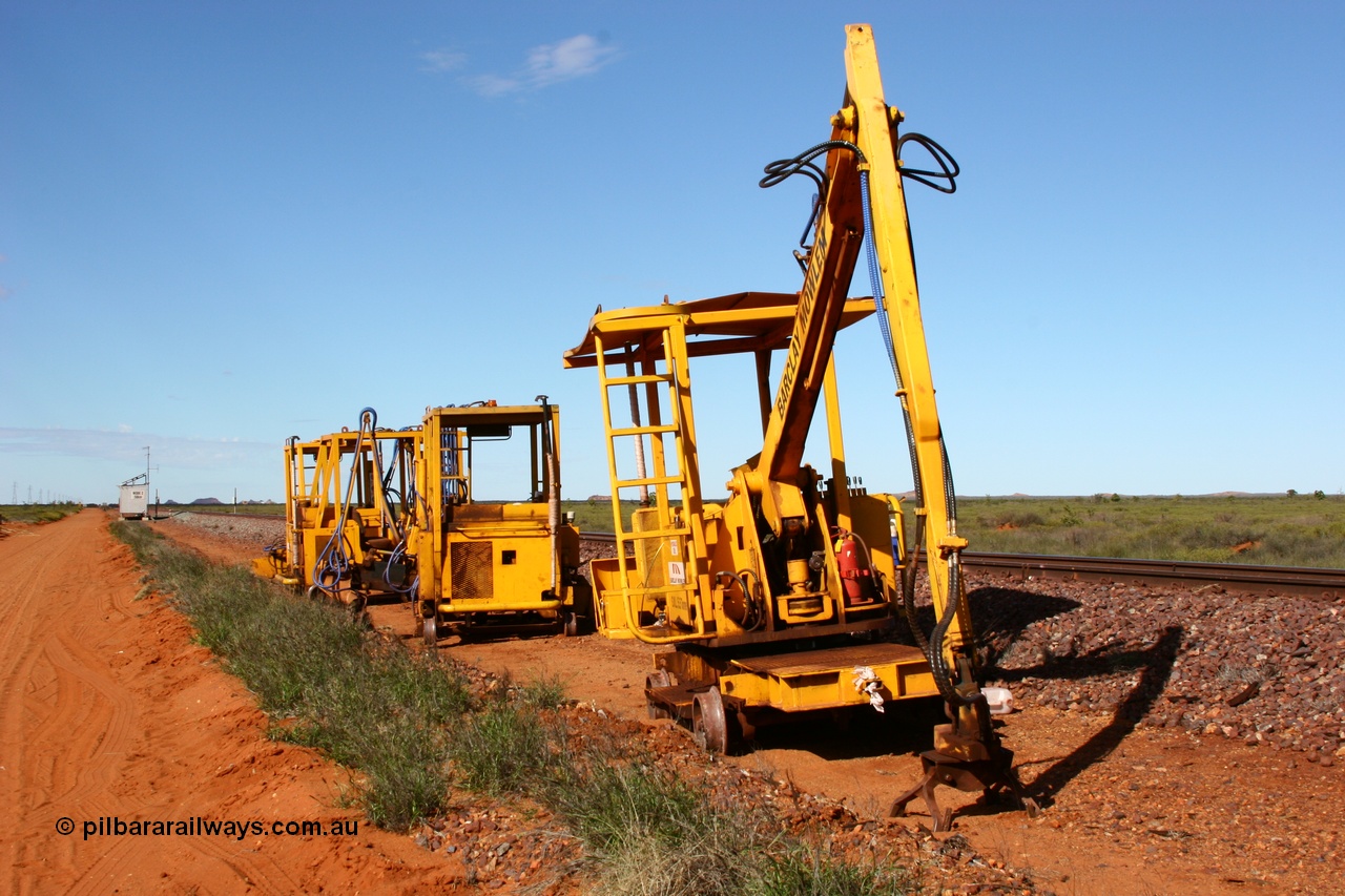 050625 3820
Node 2 at the 38 km on the GML or former Goldsworthy mainline, some Barclay Mowlem track machines are off clear of the running lines, a sleeper crane is at the front with three sleeper inserters behind. 25th June 2005.
Keywords: track-machine;