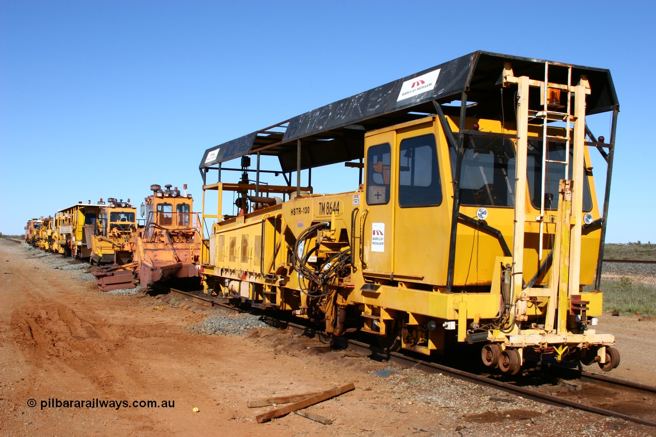 050801 4758
In the Flash Butt yard a line up of Barclay Mowlem track machines from the closest to the camera, tamper, regulator, regulator, tamper, clip installer, tamper then BHP's mainline tamper. 1st August 2005.
Keywords: TM8644;Tamper;HSTR-130;3581011;track-machine;