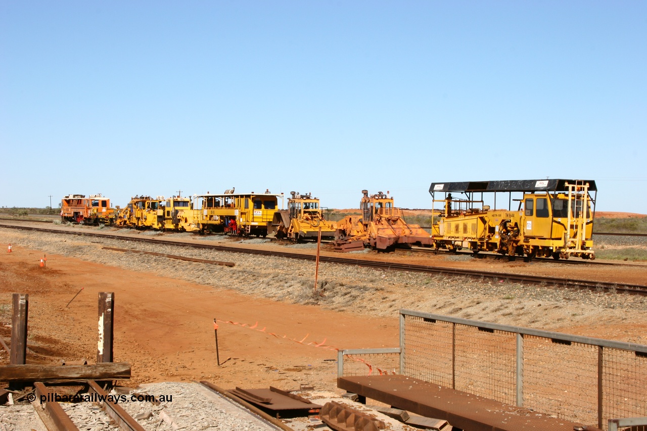 050801 4773
In the Flash Butt yard a line up of Barclay Mowlem track machines from the closest to the camera, tamper, regulator, regulator, tamper, clip installer, tamper then BHP's mainline tamper. 1st August 2005.
Keywords: track-machine;