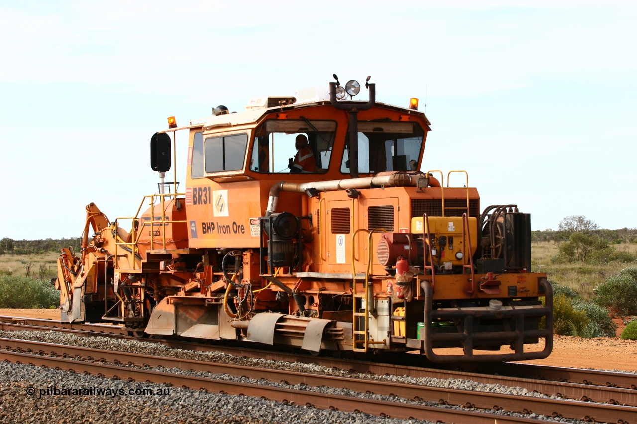 060326 3202
Bing Siding, south arrival with the mainline in the foreground as ballast regulator BR 31 a Plasser Australia SSP 110SW model serial 401 takes the passing track. 26th March 2006.
Keywords: BR31;Plasser-Australia;SSP-110SW;401;track-machine;