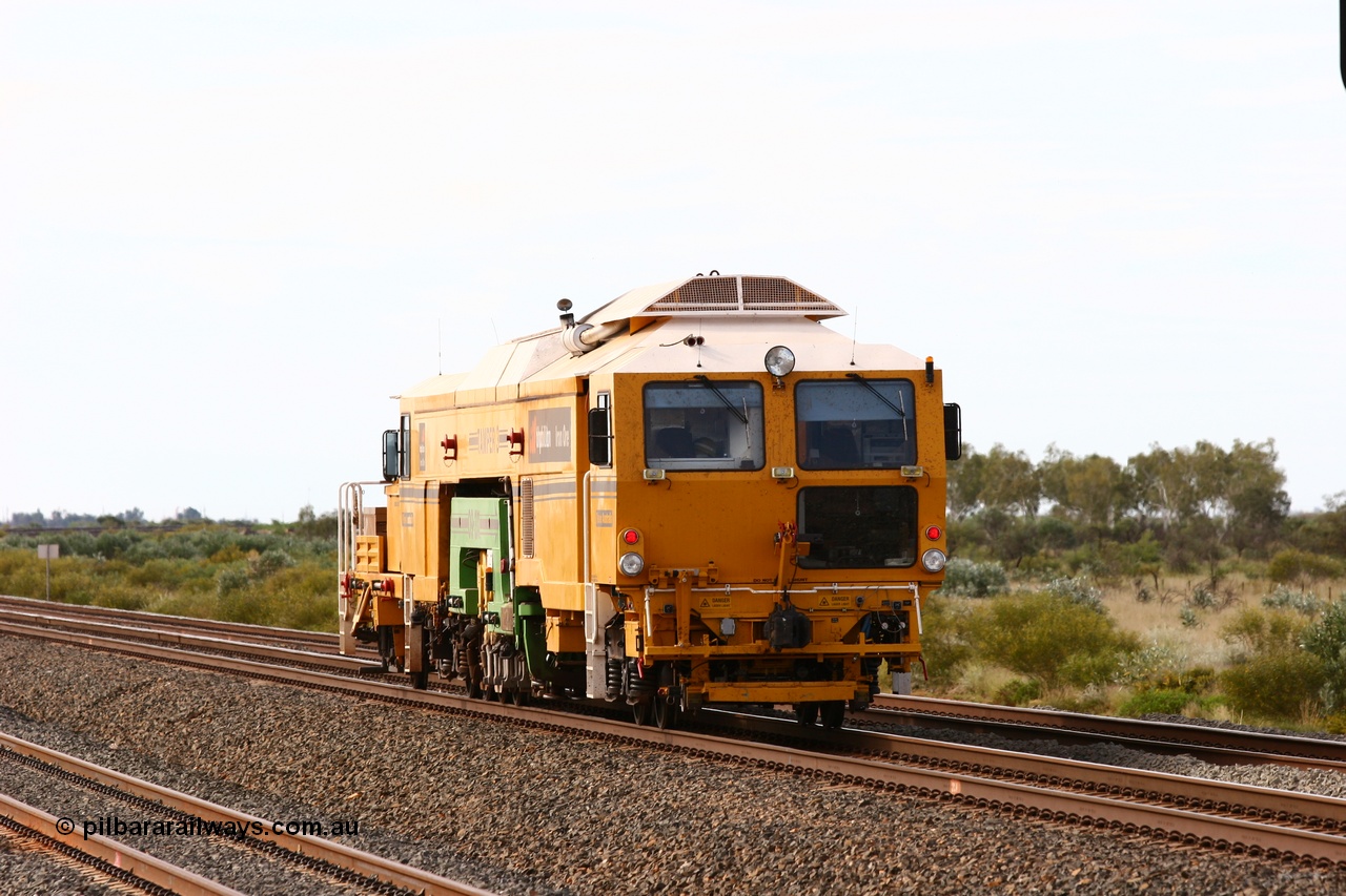 060326 3214
Bing Siding, BHP track machine Tamper 3 a Plasser Australia unit model 09-3X serial M480 runs towards Nelson Point on the mainline with the new western mainline in the foreground and Bing passing track on the right. 26th March 2006.
Keywords: Tamper3;Plasser-Australia;09-3X;M480;track-machine;