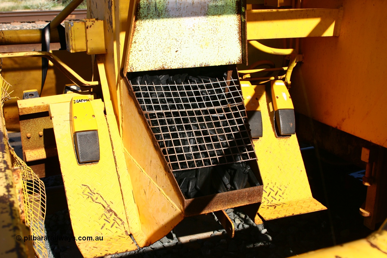 060403 3268
Tabba North backtrack, BHP clip driving machine, shows the foot pedals the operators use and basket loaded with rail insulators, modified from a former Plasser Australia USP 3000 ballast regulator. 3rd April 2006.
Keywords: track-machine;Plasser-Australia;USP3000;