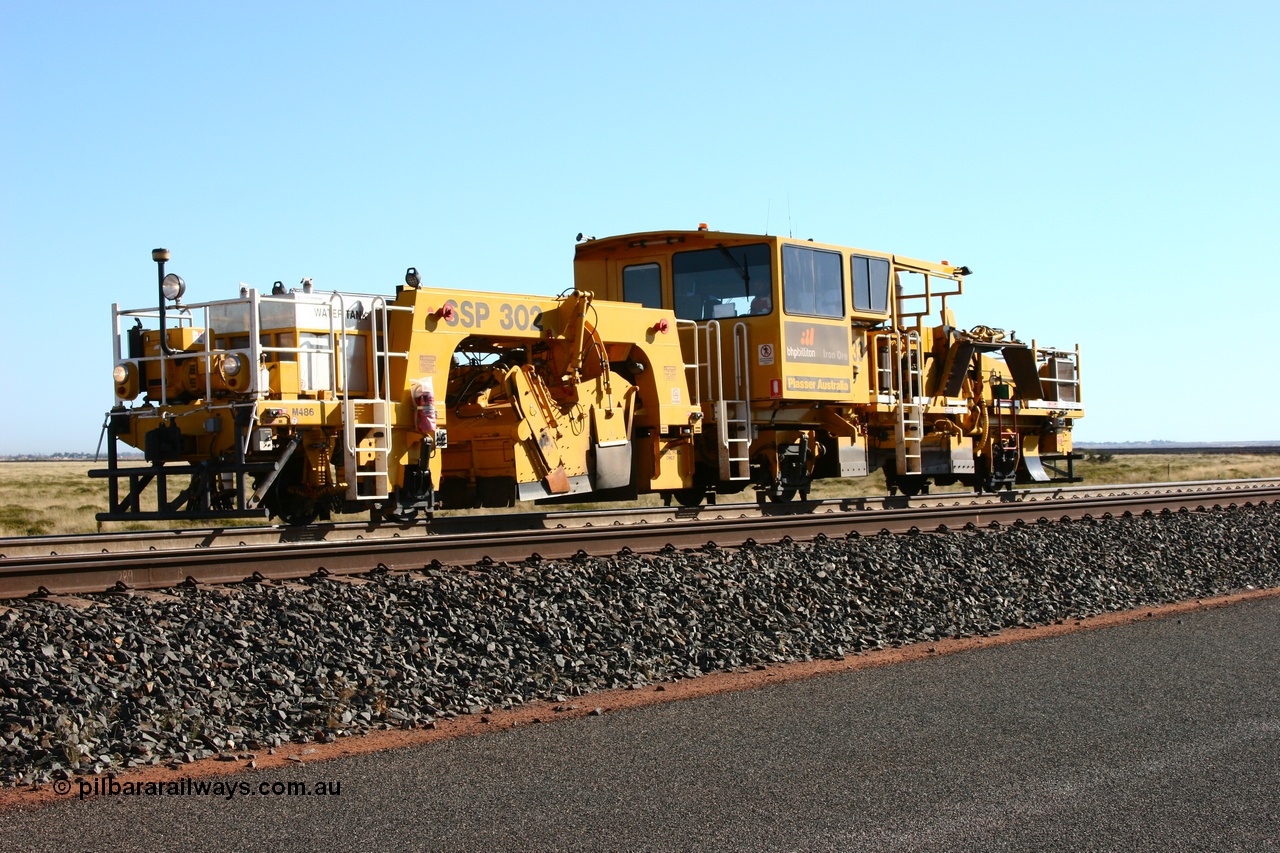 060710 6229
At the Broome Rd grade crossing Port Hedland, track machine BR 33 a Plasser Australia ballast regulator model SSP 302 serial M486. 10th July 2006.
Keywords: BR33;Plasser-Australia;SSP-302;M486;track-machine;