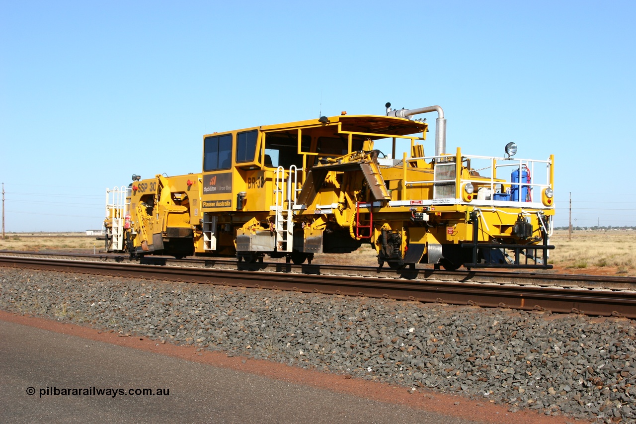 060710 6232
At the Broome Rd grade crossing Port Hedland, track machine BR 33 a Plasser Australia ballast regulator model SSP 302 serial M486. 10th July 2006.
Keywords: BR33;Plasser-Australia;SSP-302;M486;track-machine;