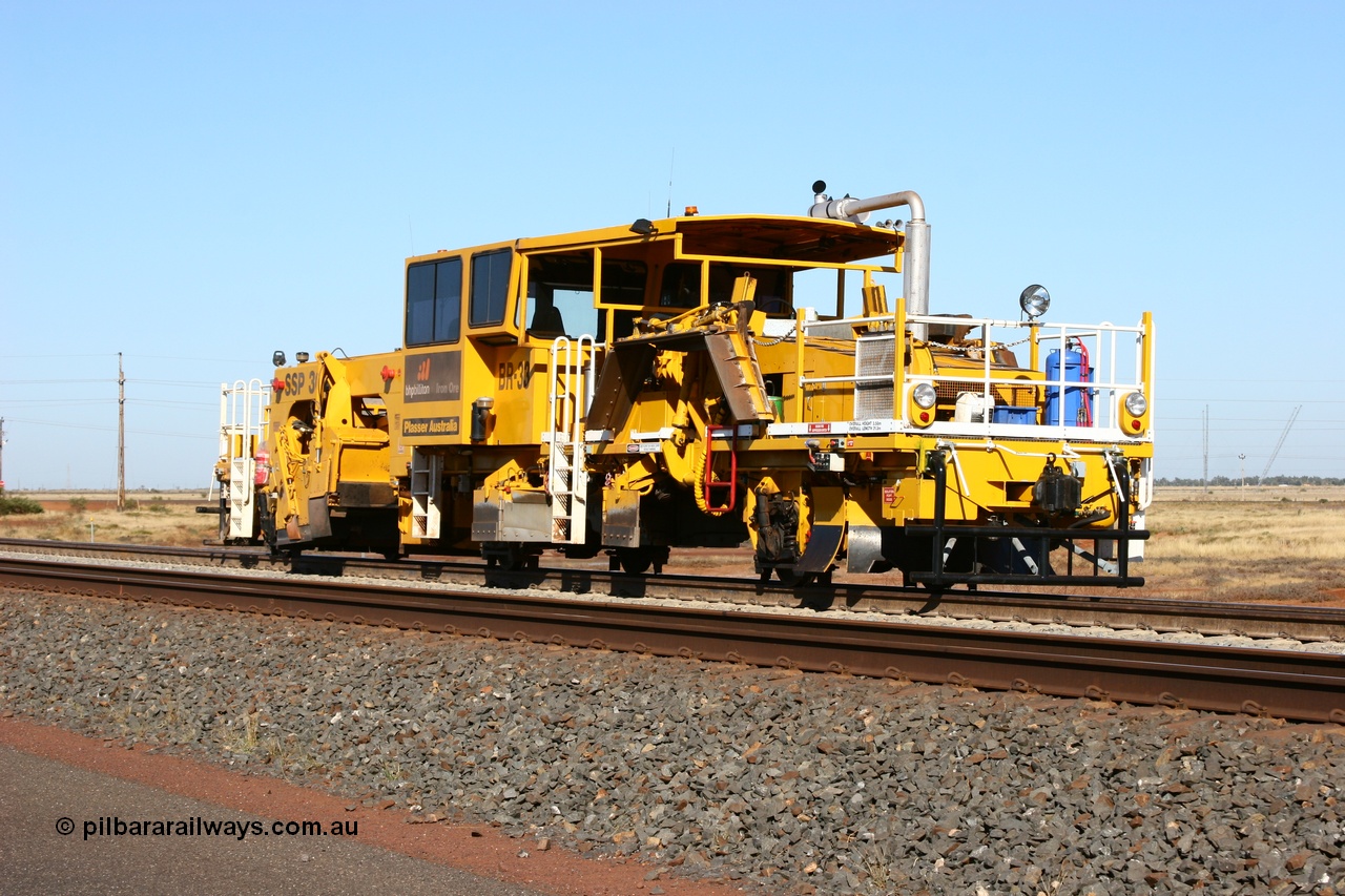 060710 6233
At the Broome Rd grade crossing Port Hedland, track machine BR 33 a Plasser Australia ballast regulator model SSP 302 serial M486. 10th July 2006.
Keywords: BR33;Plasser-Australia;SSP-302;M486;track-machine;