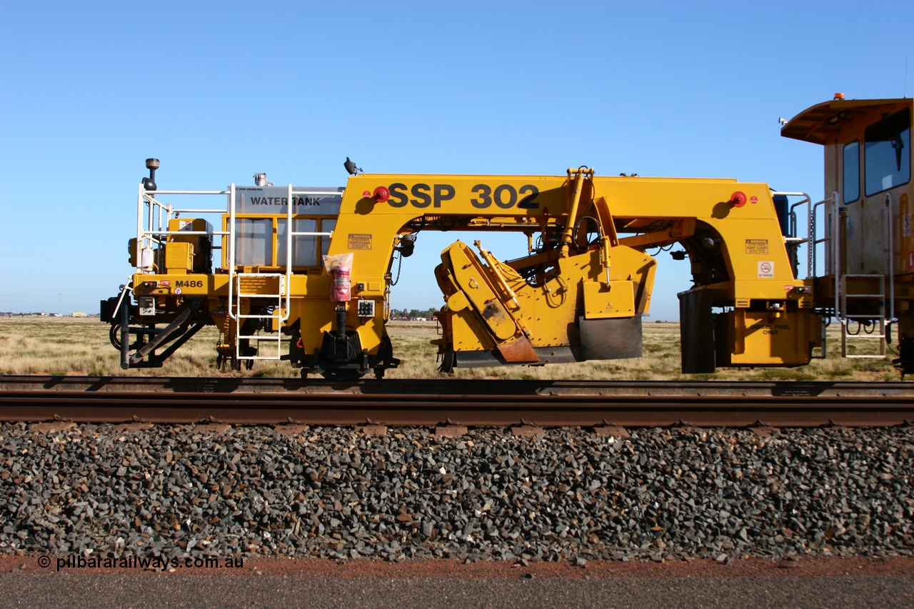 060710 6239
At the Broome Rd grade crossing Port Hedland, track machine BR 33 a Plasser Australia ballast regulator model SSP 302 serial M486. 10th July 2006.
Keywords: BR33;Plasser-Australia;SSP-302;M486;track-machine;