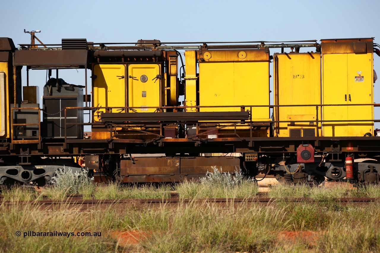 150619 9093
Flash Butt yard, Speno owned and operated rail grinder RG2 for BHP, grinding and driving cab unit. Filter and blower housings, water tank, electrical cabinet, grinding hood between bogies.
Keywords: RG2;Speno;track-machine;