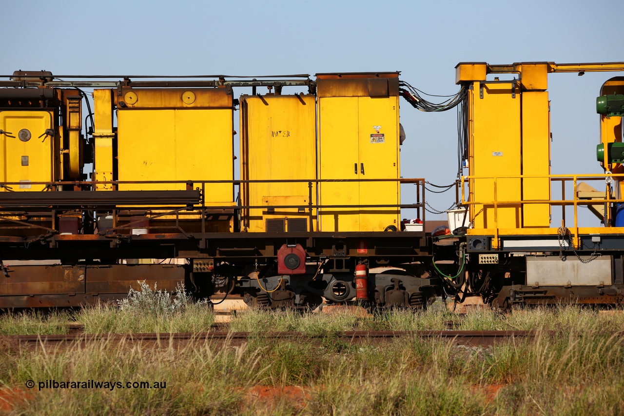 150619 9094
Flash Butt yard, Speno owned and operated rail grinder RG2 for BHP, grinding and driving cab unit. Filter and blower housings, water tank, electrical cabinet, grinding hood between bogies, shows bar connection between modules, and water tank and electrical cabinet on right hand unit.
Keywords: RG2;Speno;track-machine;