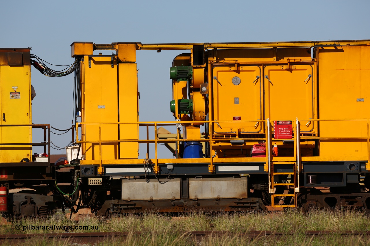 150619 9095
Flash Butt yard, Speno owned and operated rail grinder RG2 for BHP, rail grinding module, shows coupling and connections to driving module, 2500 litre water tank, electrical cabinet, blower fans and filter housing, grinding hood between bogies.
Keywords: RG2;Speno;track-machine;