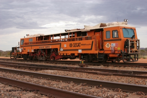 050412 0818
Abydos Siding backtrack, front view of BHP's Mainline Tamper 1, a Plasser Australia 09-32 CAT model tamper serial 306 built in 1986. 12th April 2005.
Keywords: Tamper1;Plasser-Australia;09-32-CAT;306;track-machine;