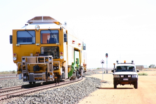 050625 3610
Mooka North, BHP's new Tamper 3 track machine a Plasser Australia 09-3X model serial M480, over exposed shot to highlight the front of the unit in shadow. 25th June 2005.
Keywords: Tamper3;Plasser-Australia;09-3X;M480;track-machine;