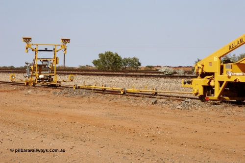 051001 5672
Flash Butt yard, Jackson model 6700 tamper serial 153246 lettered for Railway Equipment Leasing And Maintenance RELAM Inc undergoing delivery checks view of the light buggy and rods. October 1, 2005.
Keywords: Jackson;6700;153246;track-machine;