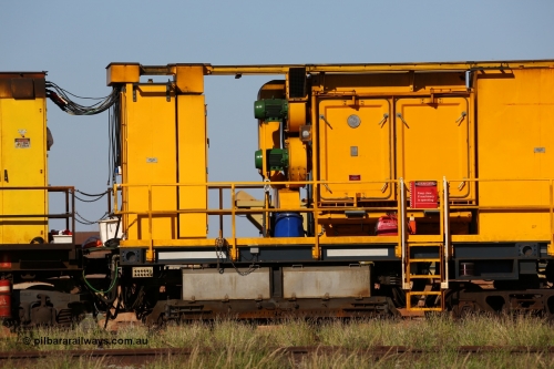 150619 9095
Flash Butt yard, Speno owned and operated rail grinder RG2 for BHP, rail grinding module, shows coupling and connections to driving module, 2500 litre water tank, electrical cabinet, blower fans and filter housing, grinding hood between bogies.
Keywords: RG2;Speno;track-machine;