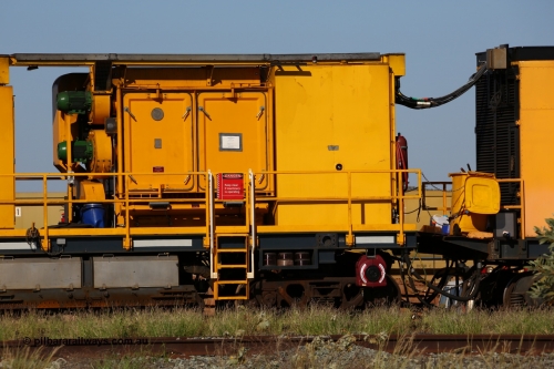 150619 9099
Flash Butt yard, Speno owned and operated rail grinder RG2 for BHP, rail grinding module, from the left blower fans and filter housing, 5000 litre fuel tank, rear of power and driving unit, grinding hood beside bogie with spare grinding stones or wheels above bogie.
Keywords: RG2;Speno;track-machine;