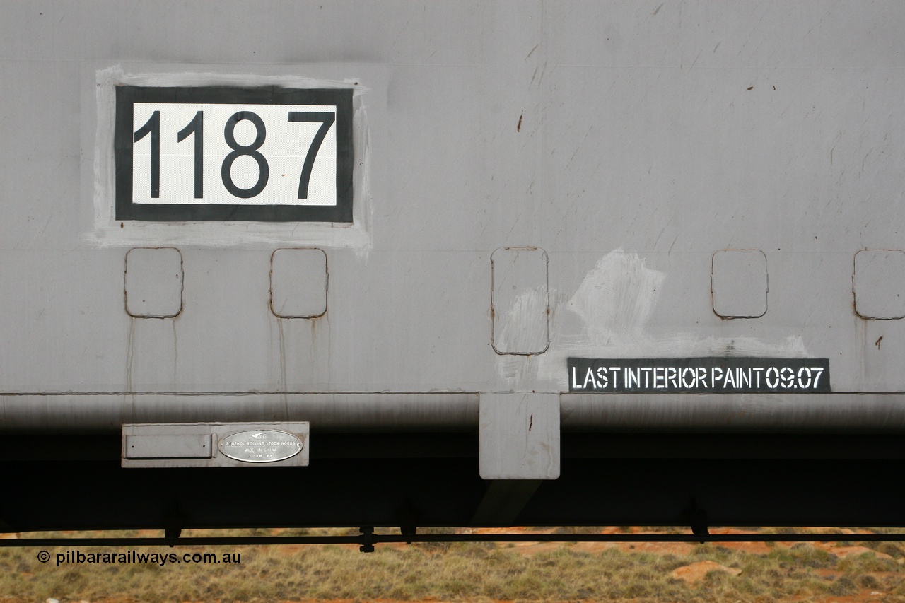 080116 1376
Chapman Siding, FMG slave waggon 1187, built by China Southern or CSR at their Zhuzhou Rolling Stock Works in China during 2007, view of the number decal builders plate and bracket for RFID tag with the last painted date placard. 16th January 2008.
Keywords: 1187;CSR-Zhuzhou-Rolling-Stock-Works-China;FMG-ore-waggon;
