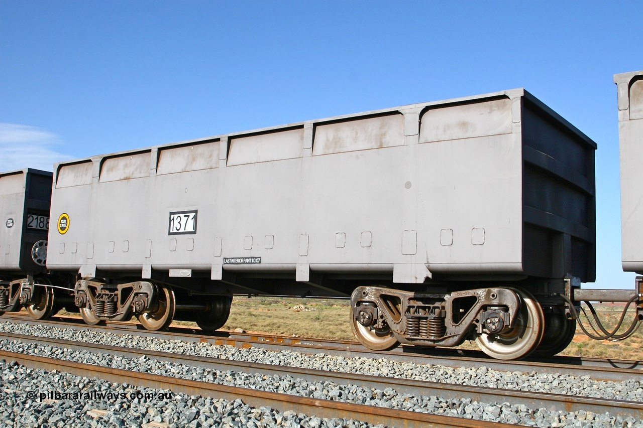 080116 1379
Chapman Siding 69 km, FMG slave waggon 1371 tare 22.6 tonnes with bar coupling to master, view bogies and number decal looking north. Built by China Southern or CSR at their Zhuzhou Rolling Stock Works in China during 2007. 16th January 2008.
Keywords: 1371;CSR-Zhuzhou-Rolling-Stock-Works-China;FMG-ore-waggon;