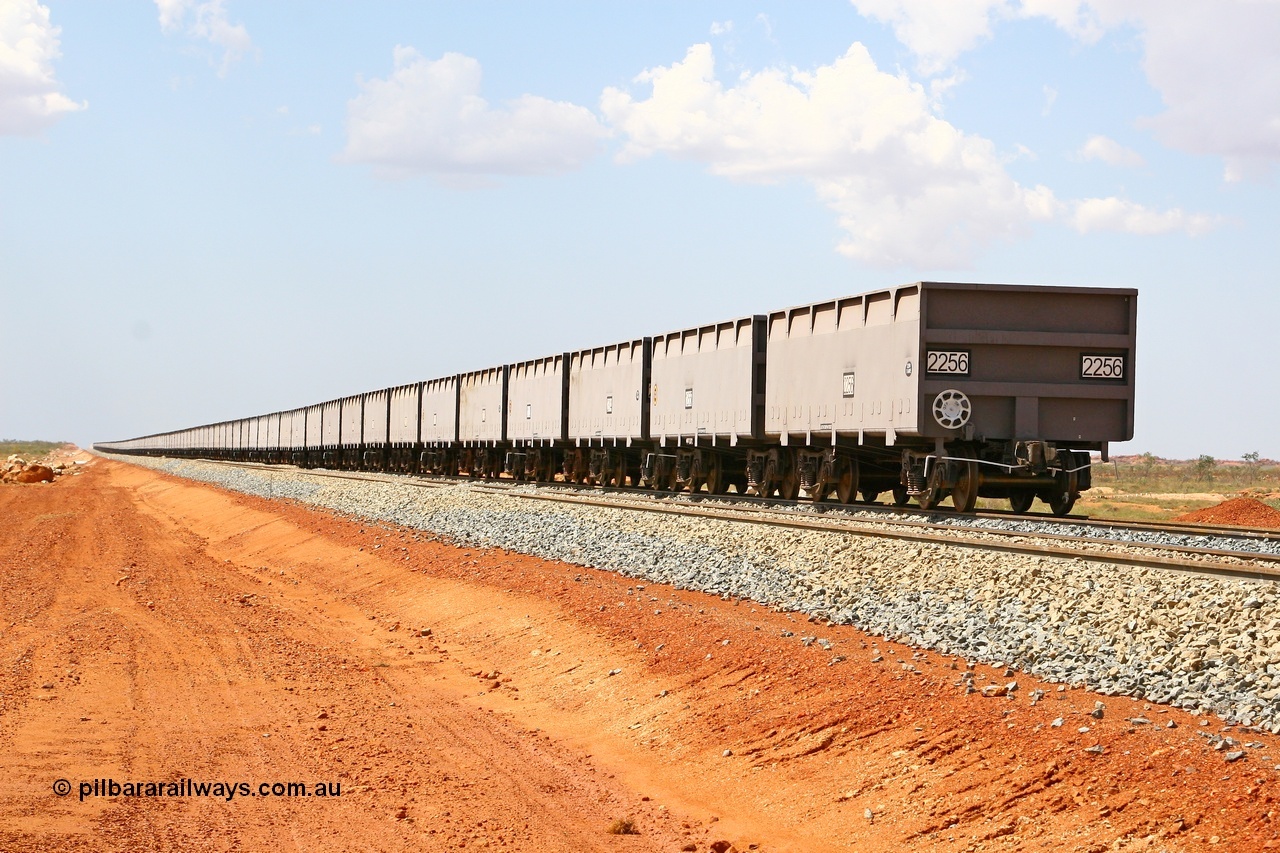 080124 1621
Chapman Siding, view looking north of a rake of new CSR Zhuzhou Rolling Stock Works China built waggons stabled in the passing track to free up yard room. 24th January 2008.
Keywords: FMG-ore-waggon;