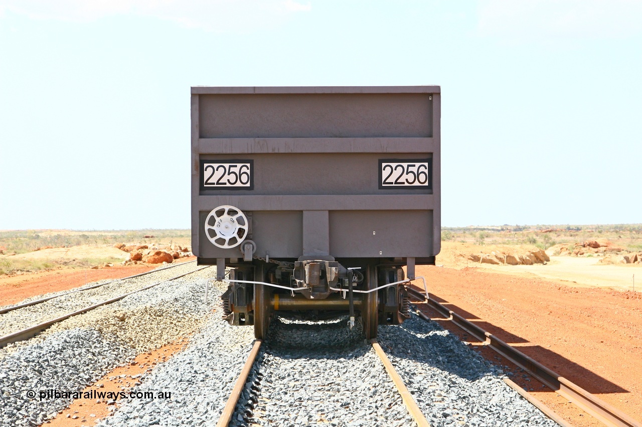 080124 1622
Chapman Siding, view of the hand brake end with F type Interlock coupling, uncoupling lever and hand brake wheel arrangement, control waggon 2256, built by China Southern or CSR at their Zhuzhou Rolling Stock Works in China in 2007. 24th January 2008.
Keywords: 2256;CSR-Zhuzhou-Rolling-Stock-Works-China;FMG-ore-waggon;