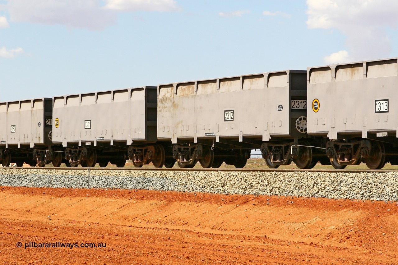 080124 1627
Chapman Siding, new FMG ore waggon pair 1311 slave and 2312 control, built by China Southern or CSR at their Zhuzhou Rolling Stock Works in China in 2007. 24th January 2008.
Keywords: 1311-2312;CSR-Zhuzhou-Rolling-Stock-Works-China;FMG-ore-waggon;