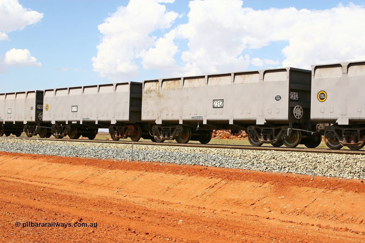 080124 1630
Chapman Siding, new FMG ore waggon pair 1311 slave and 2312 control, built by China Southern or CSR at their Zhuzhou Rolling Stock Works in China in 2007. 24th January 2008.
Keywords: 1311-2312;CSR-Zhuzhou-Rolling-Stock-Works-China;FMG-ore-waggon;