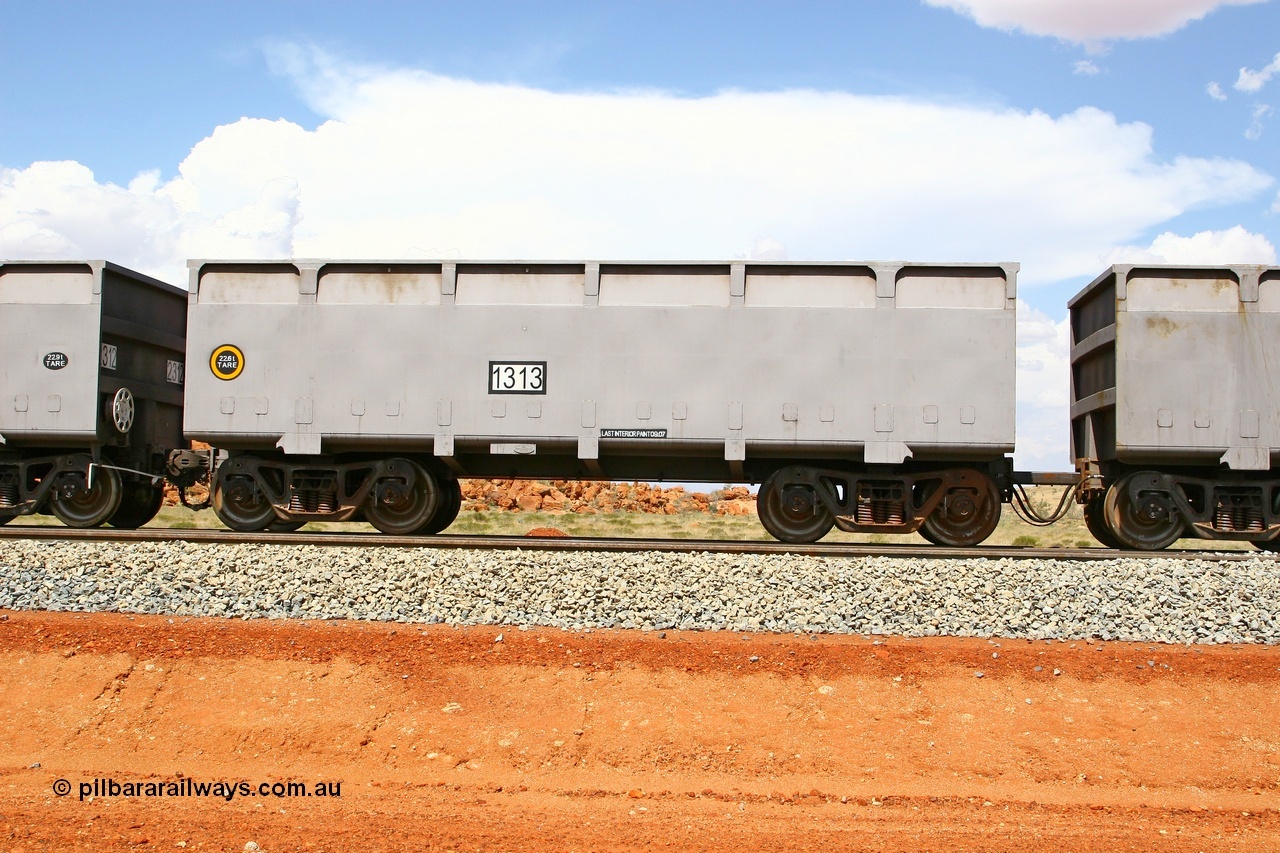 080124 1632
Chapman Siding, side view of slave waggon 1313, the yellow circle around the tare weight 22.6 t indicates the rotary coupler end, built by China Southern or CSR at their Zhuzhou Rolling Stock Works in China in 2007. 24th January 2008.
Keywords: 1313;CSR-Zhuzhou-Rolling-Stock-Works-China;FMG-ore-waggon;