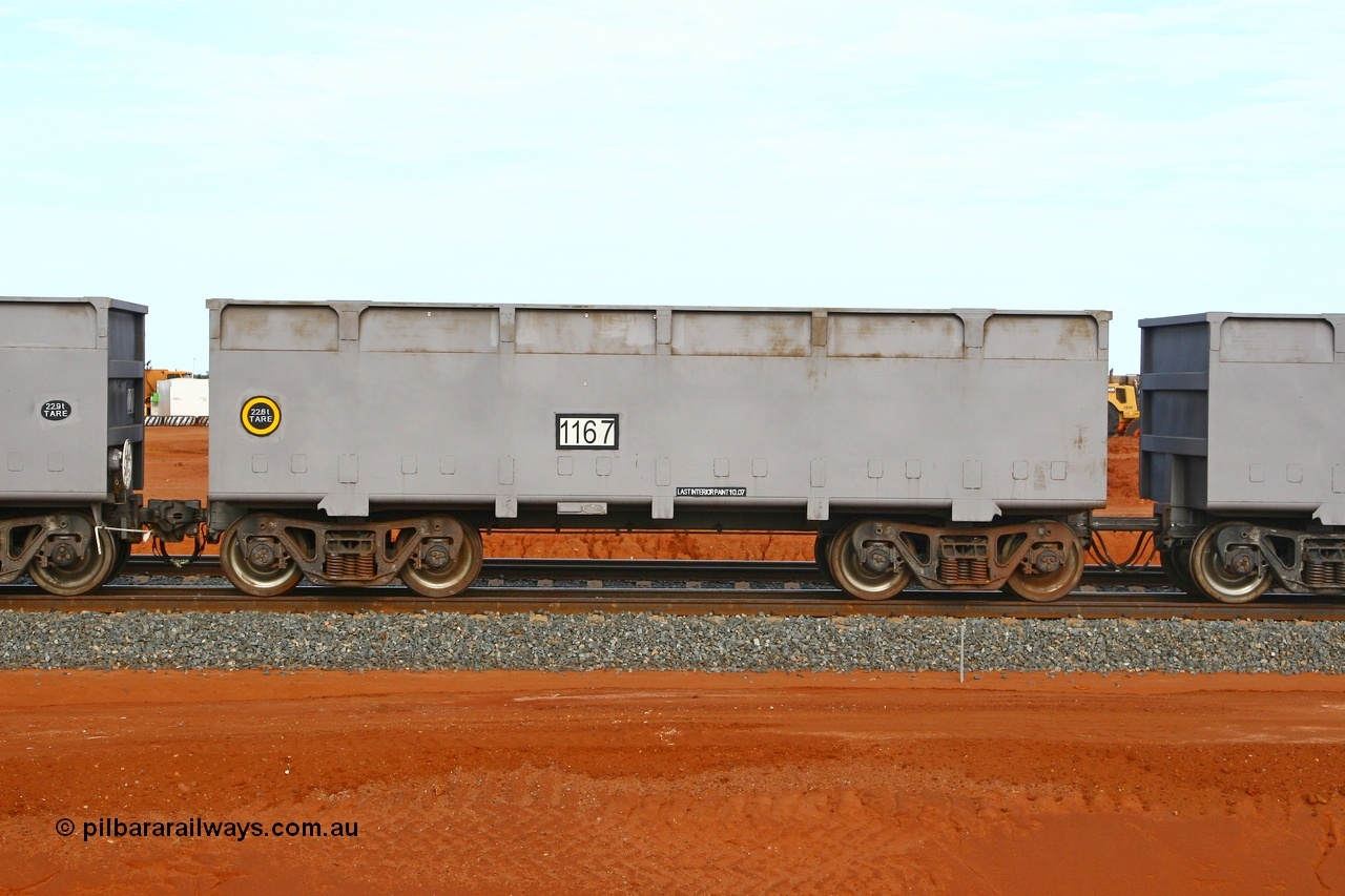 080304 2176
Thomas Yard, down the rail welding end, side view of slave waggon 1167, the yellow circle around the tare weight 22.6 t indicates the rotary coupler end, built by China Southern or CSR at their Zhuzhou Rolling Stock Works in China in 2007. 4th March 2008.
Keywords: 1167;CSR-Zhuzhou-Rolling-Stock-Works-China;FMG-ore-waggon;