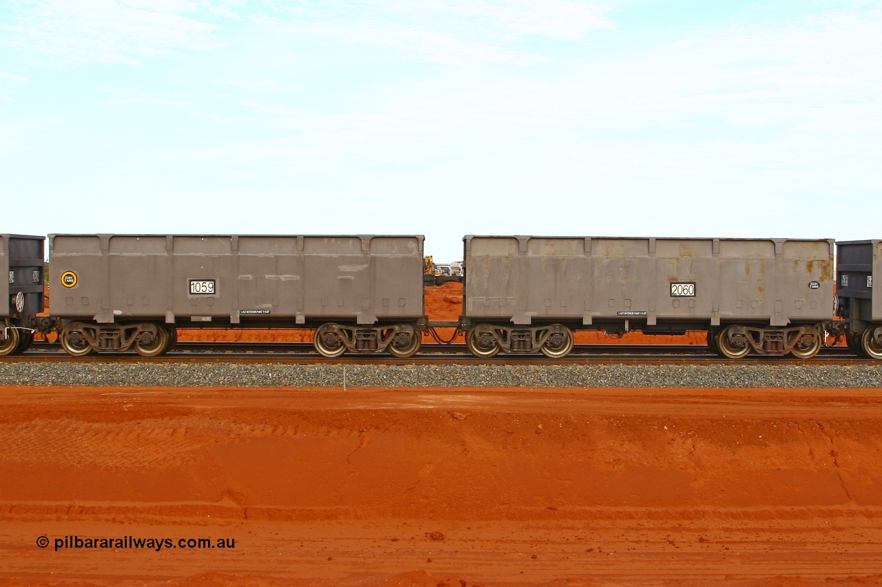 080304 2197
Thomas Yard, down the rail welding end, new FMG ore waggon pair 1059 slave and 2060 control, built by China Southern or CSR at their Zhuzhou Rolling Stock Works in China in 2007. 4th March 2008.
Keywords: 1059-2060;CSR-Zhuzhou-Rolling-Stock-Works-China;FMG-ore-waggon;