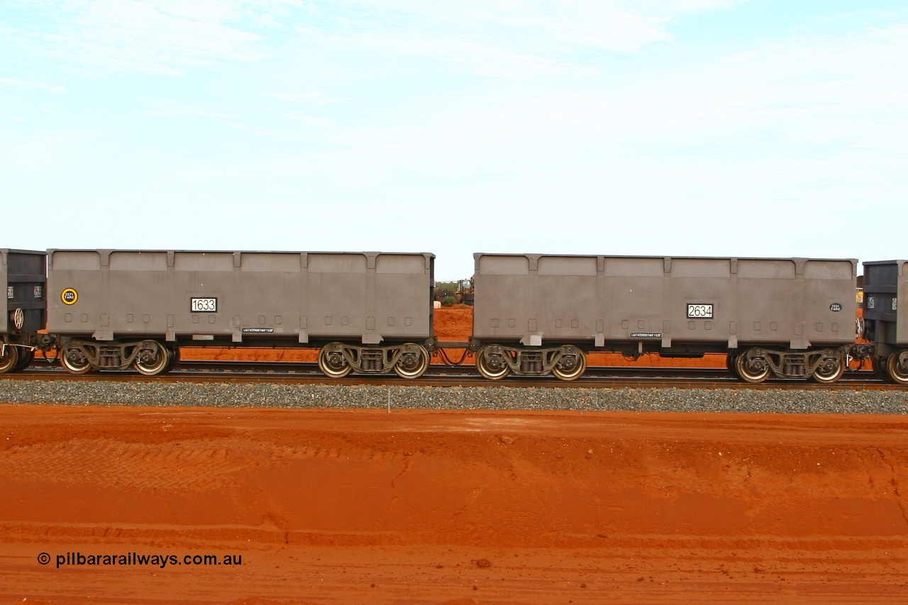 080304 2199
Thomas Yard, down the rail welding end, new FMG ore waggon pair 1633 slave and 2634 control, built by China Southern or CSR at their Zhuzhou Rolling Stock Works in China in 2007. 4th March 2008.
Keywords: 1633-2634;CSR-Zhuzhou-Rolling-Stock-Works-China;FMG-ore-waggon;