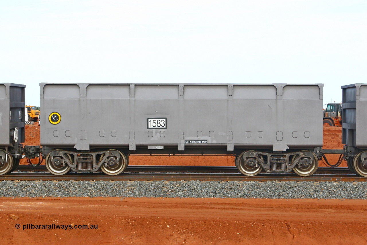 080304 2209
Thomas Yard, down the rail welding end, side view of slave waggon 1583, the yellow circle around the tare weight 22.6 t indicates the rotary coupler end, built by China Southern or CSR at their Zhuzhou Rolling Stock Works in China in 2007. 4th March 2008.
Keywords: 1583;CSR-Zhuzhou-Rolling-Stock-Works-China;FMG-ore-waggon;