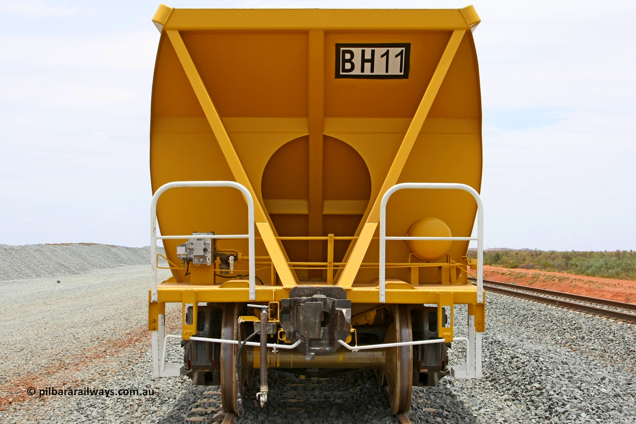 081225 0566
Barker Siding, one of FMG's thirty five ballast waggons, BH 11, non-handbrake end view, 100 tonne capacity, built in China by CSR at the Yangtze Rolling Stock Company in 2008. December 25, 2008.
Keywords: BH11;CSR-Yangtze-Rolling-Stock-Co-China;FMG-ballast-waggon;