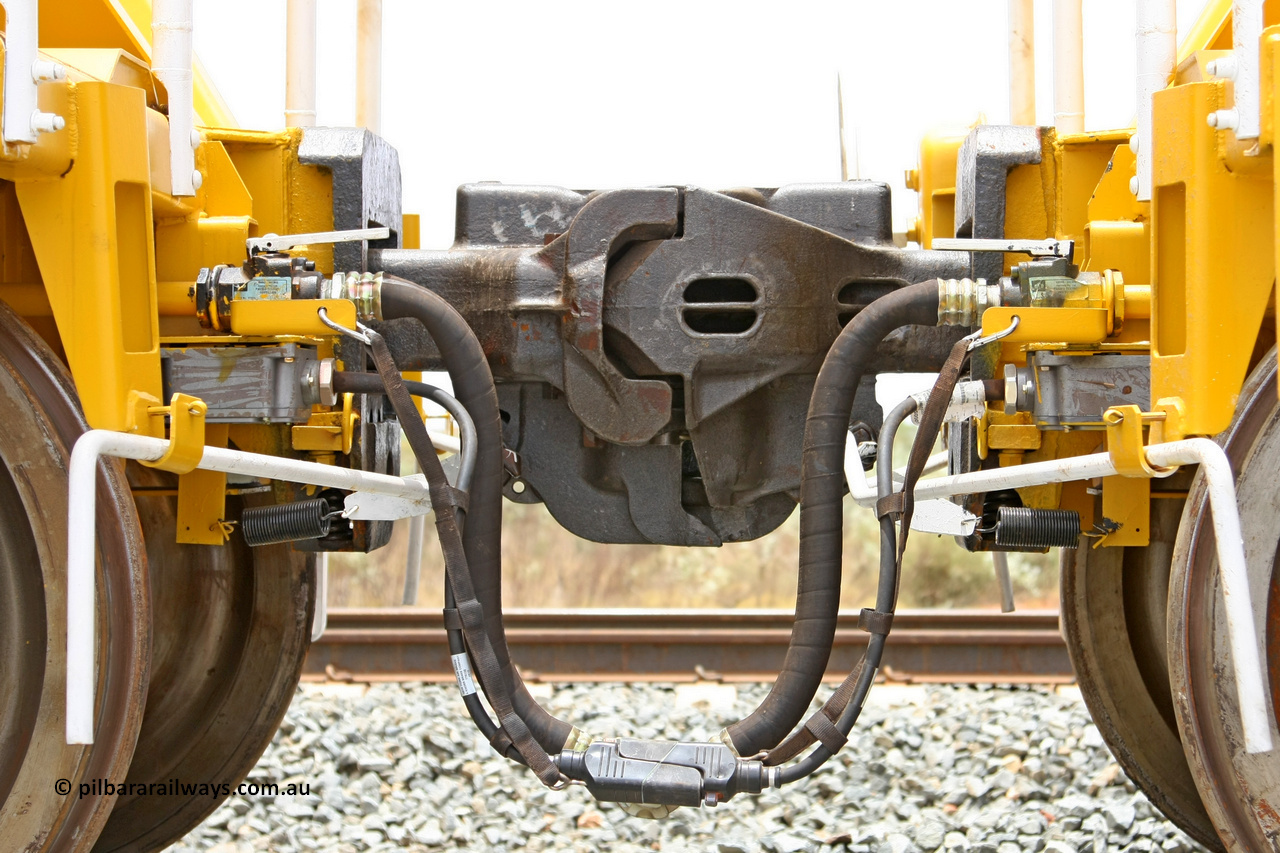 081225 0573
Barker Siding, view of two of FMG's ballast waggons F type couplings, electric and air connections. 100 tonne capacity, built in China by CSR at the Yangtze Rolling Stock Company in 2008. December 25, 2008.
Keywords: CSR-Yangtze-Rolling-Stock-Co-China;FMG-ballast-waggon;