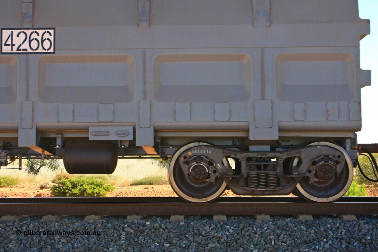 110620 2218
Forrest Siding near the 126 km, detail shot of empty FMG ore waggon 4266 showing the builders plate, RFID tag, number decal and bogie detail. CNR QRRS of China built waggon dating from 2011. 20th June 2011.
Keywords: 4266;CNR-QRRS-China;FMG-ore-waggon;