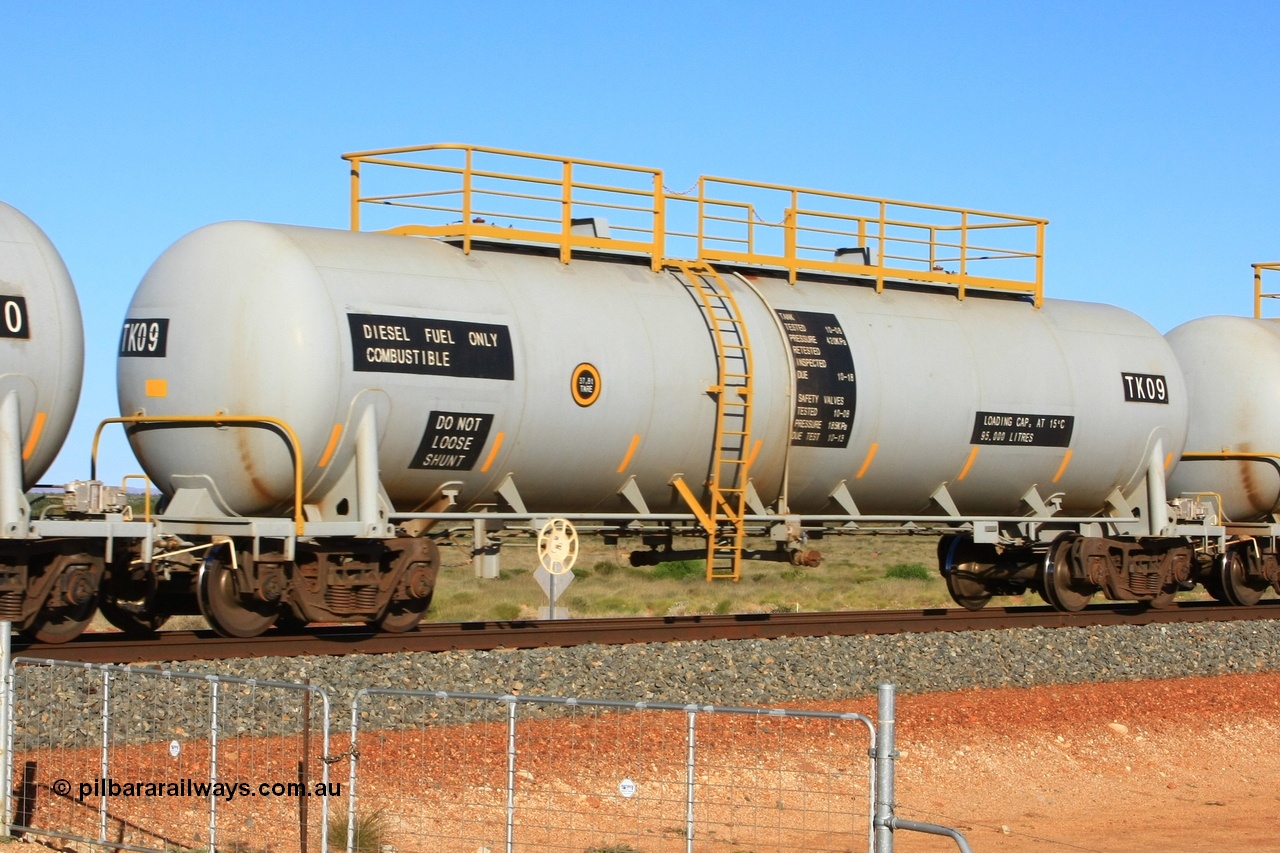 110620 2273
Chapman, FMG TK type fuel tank waggon TK 09 built by China Southern CSR at their Zhuzhou Rolling Stock Works plant in China in 2008 as part of an order for twelve tanks, is on the loaded fuel train to Cloud Break. 20th June 2011.
Keywords: TK09;TK-type;CSR-Zhuzhou-Rolling-Stock-Works-China;FMG-tank-waggon;