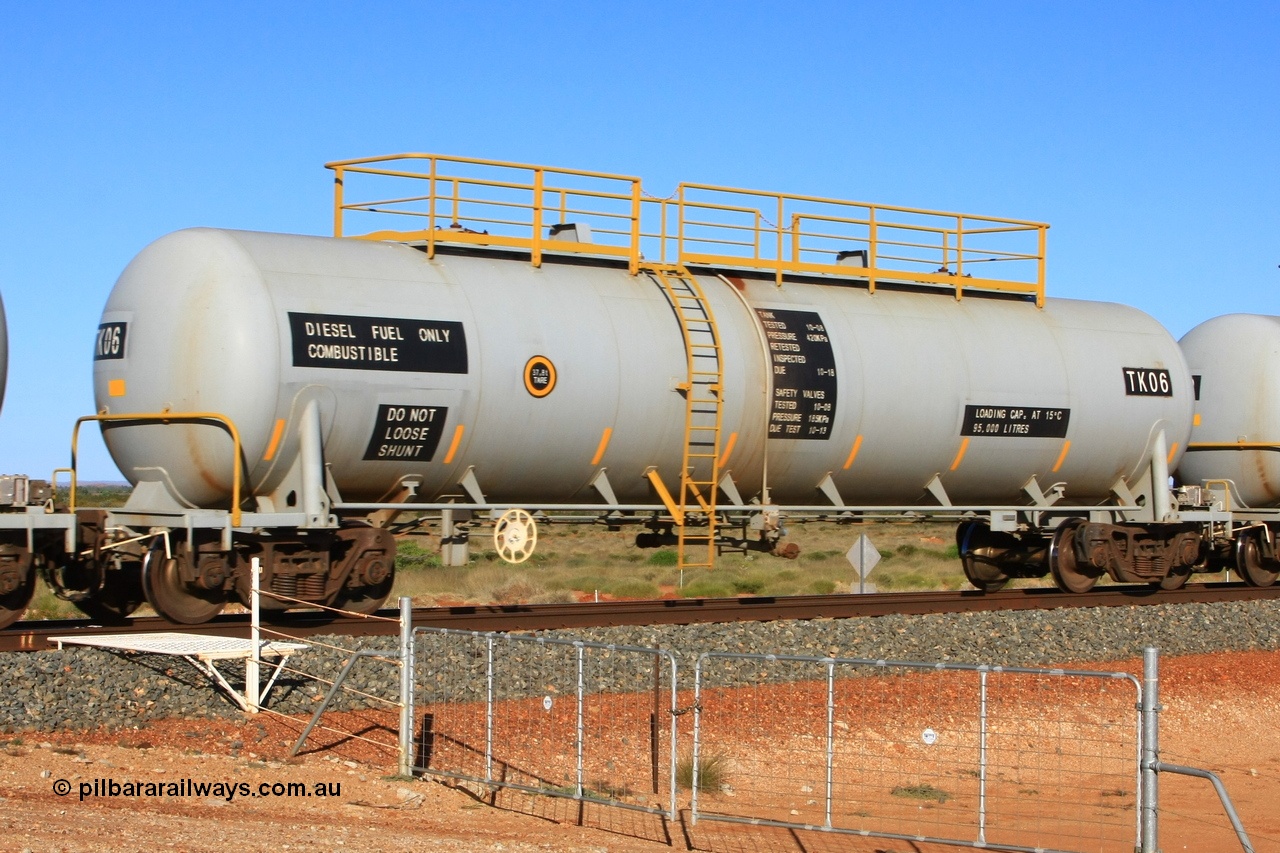 110620 2275
Chapman, FMG TK type fuel tank waggon TK 06 built by China Southern CSR at their Zhuzhou Rolling Stock Works plant in China in 2008 as part of an order for twelve tanks, is on the loaded fuel train to Cloud Break. 20th June 2011.
Keywords: TK06;TK-type;CSR-Zhuzhou-Rolling-Stock-Works-China;FMG-tank-waggon;