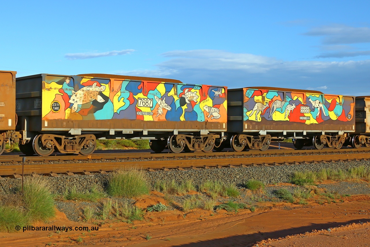 200412 6176
Boodarie, part of a loaded FMG train, painted ore waggon pair 7687 - 8688 built by CRRC Yangtze Rolling Stock Co. of China in 2018, it features mural painting by students of South Hedland High School and was painted in August 2018. April 12, 2020.
Keywords: 7687-8688;CRRC-Yangtze-China;FMG-ore-waggon