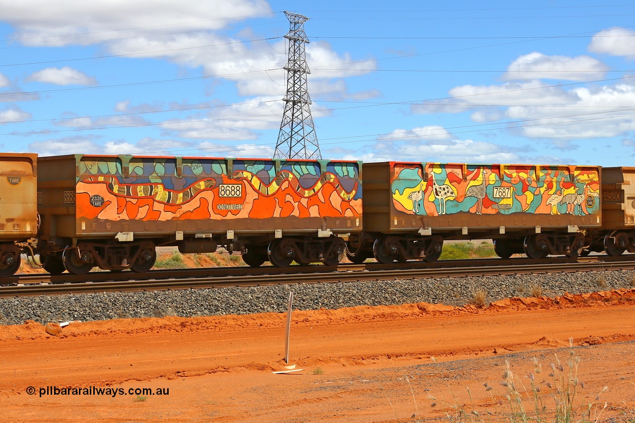 210321 9036
Boodarie, part of a loaded FMG train, painted ore waggon pair 7687 - 8688 built by CRRC Yangtze Rolling Stock Co. of China in 2018, it features mural painting by students of South Hedland High School and was painted in August 2018. March 21, 2021.
Keywords: 7687-8688;CRRC-Yangtze-China;FMG-ore-waggon