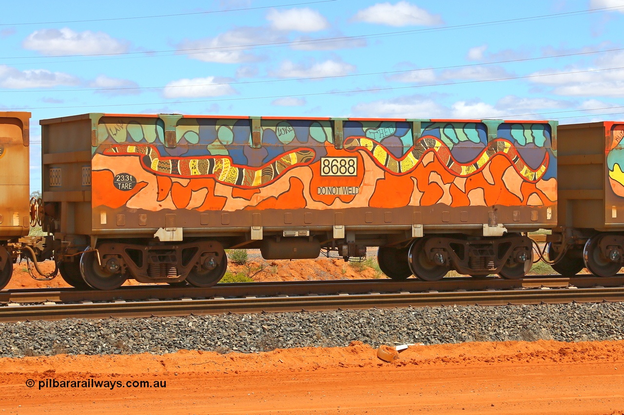 210321 9037
Boodarie, part of a loaded FMG train, painted ore waggon pair 7687 - 8688 built by CRRC Yangtze Rolling Stock Co. of China in 2018, 8688 waggon view, it features mural painting by students of South Hedland High School and was painted in August 2018. March 21, 2021.
Keywords: 7687-8688;CRRC-Yangtze-China;FMG-ore-waggon