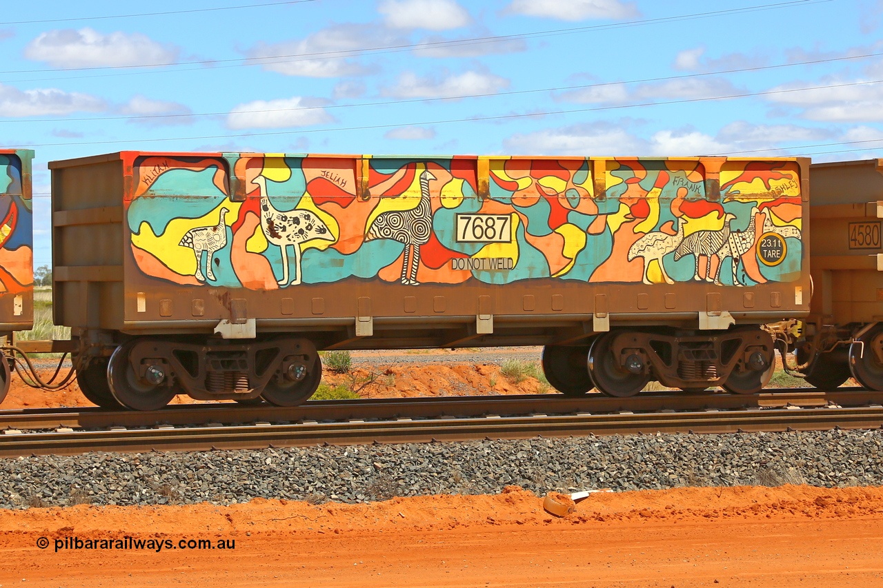 210321 9038
Boodarie, part of a loaded FMG train, painted ore waggon pair 7687 - 8688 built by CRRC Yangtze Rolling Stock Co. of China in 2018, 7687 waggon view, it features mural painting by students of South Hedland High School and was painted in August 2018. March 21, 2021.
Keywords: 7687-8688;CRRC-Yangtze-China;FMG-ore-waggon