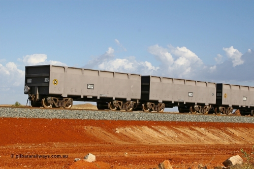 01395-02396 080116 1364
Chapman Siding at the 69 km on FMG's under construction line to Cloud Break mine, new waggons stabled in the passing track awaiting service, built by China Southern or CSR at their Zhuzhou Rolling Stock Works in China in 2007, here slave waggon 1395 and master waggon 2396 sit in the arvo sunlight. The yellow circle indicates the rotary coupler end and the tare weight of the slave waggon at 22.6 tonnes, while the master weighs 22.9 tonnes as it hosts the brake control equipment. 16th January 2008. 
Keywords: 1395-2396;CSR-Zhuzhou-Rolling-Stock-Works-China;FMG-ore-waggon;