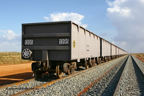 01395 080116 1367
Chapman Siding at the 69 km on FMG's under construction line to Cloud Break mine, new waggons stabled in the passing track awaiting service, built by China Southern or CSR at their Zhuzhou Rolling Stock Works in China in 2007, looking south along the rake with 1395 closest to the camera. 16th January 2008.
Keywords: 1395;CSR-Zhuzhou-Rolling-Stock-Works-China;FMG-ore-waggon;