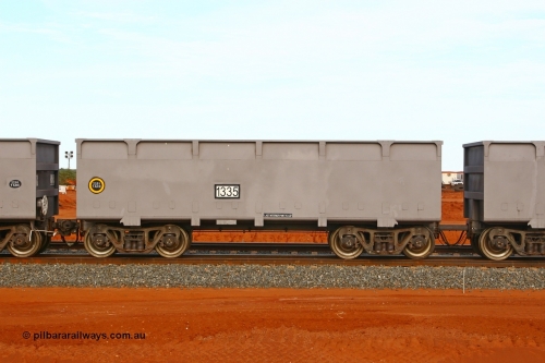 01335 080304 2190
Thomas Yard, down the rail welding end, side view of slave waggon 1335, the yellow circle around the tare weight 22.6 t indicates the rotary coupler end, built by China Southern or CSR at their Zhuzhou Rolling Stock Works in China in 2007. 4th March 2008.
Keywords: 1335;CSR-Zhuzhou-Rolling-Stock-Works-China;FMG-ore-waggon;