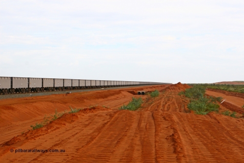 080304 2192
Thomas Yard, looking south, long rake of waggons being run up and down the mainline to keep the wheels turning. 4th March 2008.
Keywords: FMG-ore-waggon;