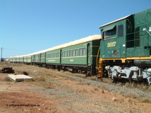 041014 142318
Pilbara Railways Historical Society, view along the passenger carriages behind rebuilt ALCo C636R locomotive 3017 with the first passenger carriage 'Bellary' was originally built by Clyde Engineering at Granville NSW in 1936 for the NSWGR as a second class railway carriage FS type FS 2143. In 1987 it was purchased by the Society and is named after a local river. The next carriage is van 'Portland' and originally an NSWGR MHO type guards van MHO 2321, then recoded to KB type mail van, then to KBY 2513 guards van. For a view 20 years later [url=https://pilbararailways.com.au/gallery/displayimage.php?pid=17751]click here[/url]. 14th October 2004.
Keywords: 3017;Comeng-WA;ALCo;C636R;WA-135-C-6043-04;rebuild