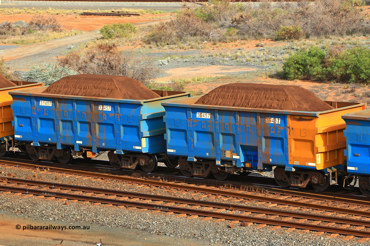 240619 0339
Cape Lambert yard, one of Rio Tinto's blue rakes with spring park brake and only electronic controlled pneumatic [ECP] braking, waggon pair 31457 is a master and is bar coupled to slave waggon 36457 built by China Northen as a Q type in 12/2022. Captured on June 19, 2024.
Keywords: 31457;36457;Q-type;China-Northern;Rio-ore-waggon;